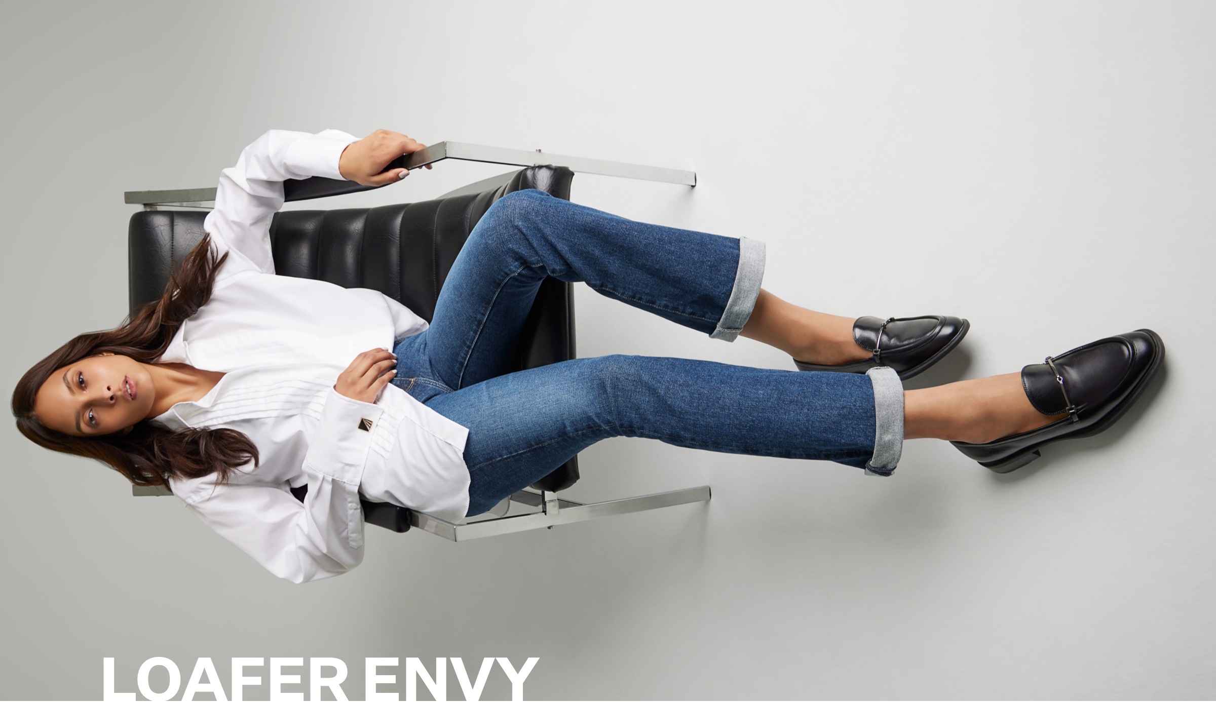model wearing the Sarto Eda loafer in black leather
