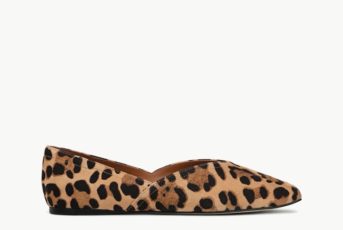 Side view of a women’s leopard loafer with a pointed toe.  