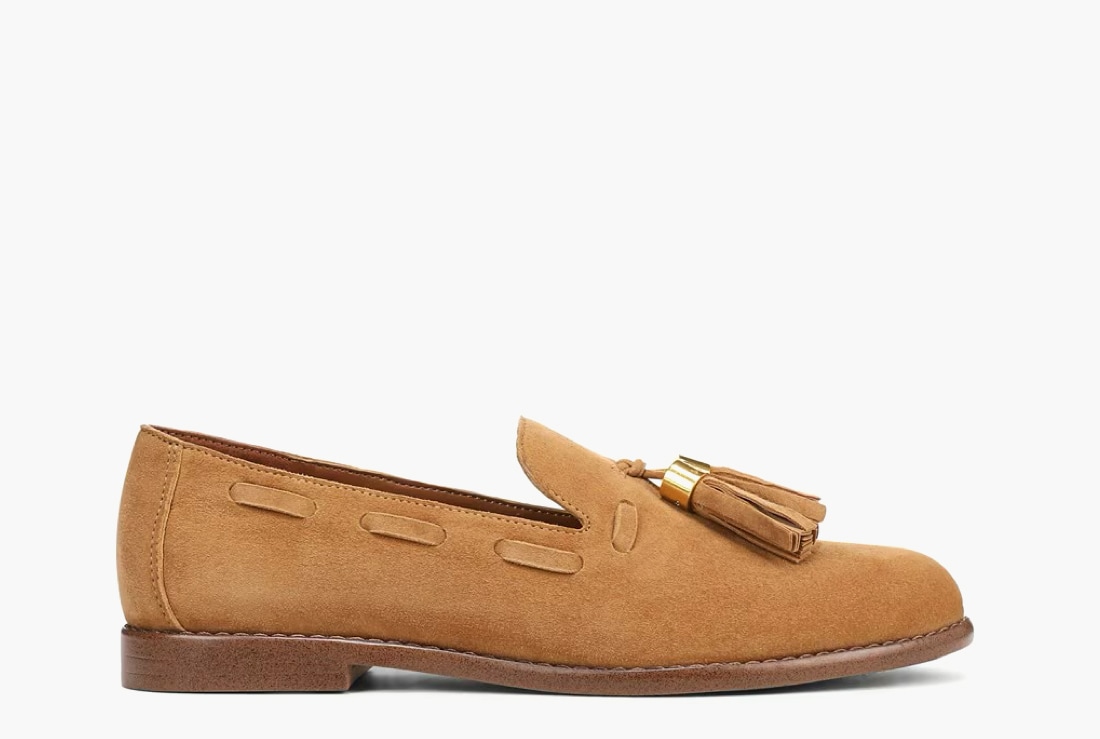 Side view of a women’s loafer in a tan suede color.   