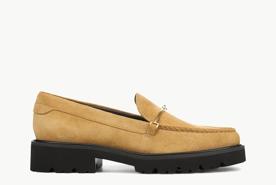 Side view of a women’s lug sole loafer in a tan suede color.   