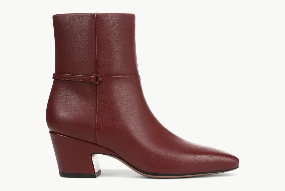 Side view of a women’s heeled ankle boot in red leather.  